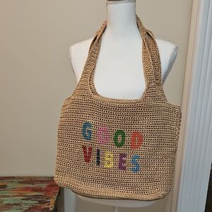 The Sak Tan Woven Tote with Colorful Lettering